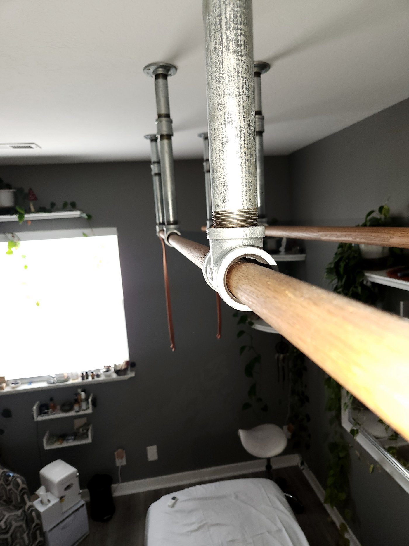 Ceiling-mounted Ashiatsu Oriental Bar hardware in Michael Jaece's massage studio in Orem, Utah.