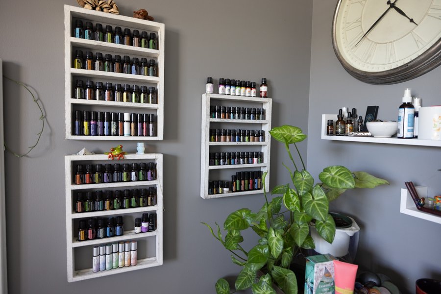 Apothecary wall of essential oils in Michael Jaece's massage studio in Orem, Utah.